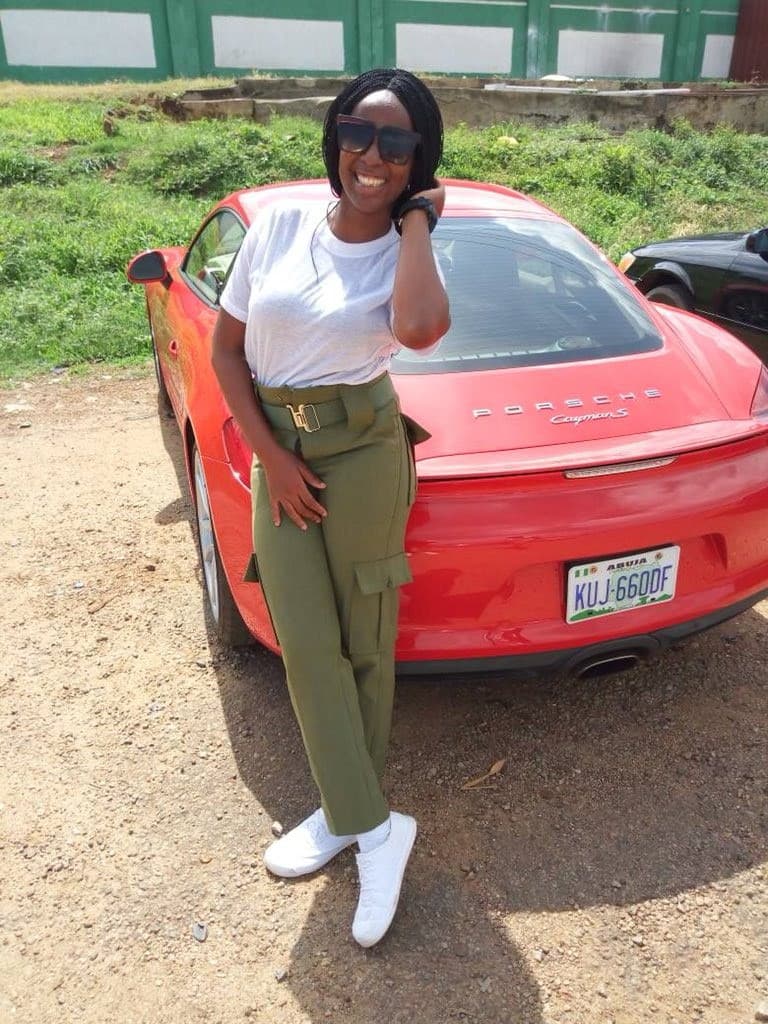 Female Corps Member Steps Out With Porsche For Clearance in Abuja